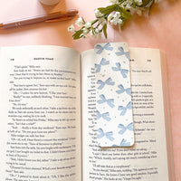 girly vintage styled bookmark with lots of blue bows in a pattern for reading books for girls, all blue coquette and feminine