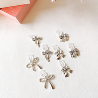cute silver bow charms for dust plug kindle charm idea, kindle charms for kindles, silver bow charms, bow charms, jewelry bow charms, iPhone charms, cute silver charms