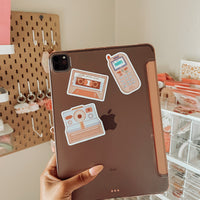 the 90s nostalgia sticker collection with the ultimate mixtape, zokia cell phone, and polaroid camera