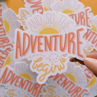 And so the adventure begins glossy vinyl sticker. A hand drawn sticker with sun rising and paper airplane