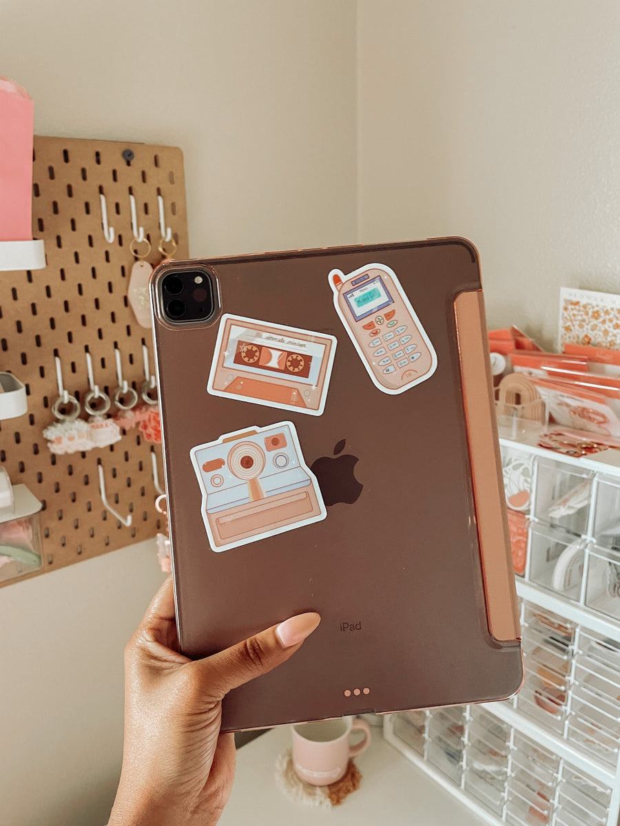 the 90s nostalgia sticker collection with the ultimate mixtape, zokia cell phone, and polaroid camera