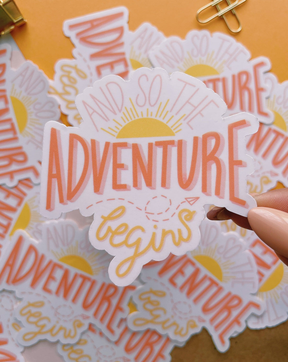 And so the adventure begins glossy vinyl sticker. A hand drawn sticker with sun rising and paper airplane 